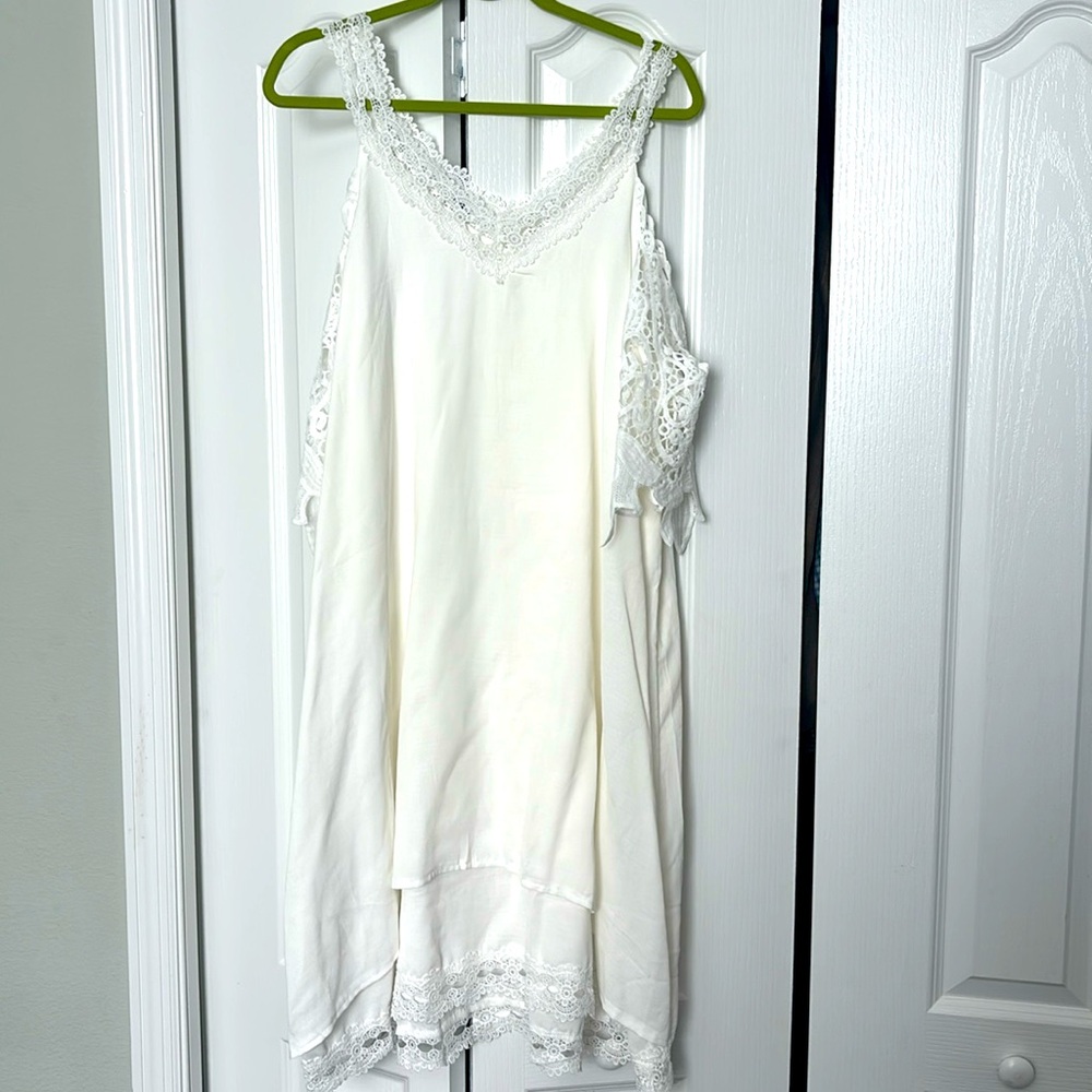 White dress with crochet sleeves and trim